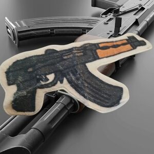 Black and Orange Gun-Shaped Rug